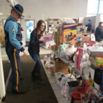 Troopers putting donations on tables
