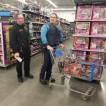 State troopers with a cart shopping for items