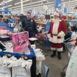Santa and a state trooper at the checkout line