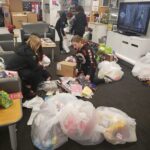 Volunteers sorting through donations