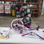 Volunteer putting together a bike