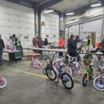 bikes with a volunteer in the back ground