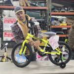 A volunteer putting together a bike