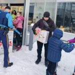 Unloading toys from State Troopers vehicles.