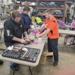 Volunteers assembling a bike