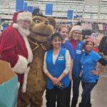 Santa, Walmart employees, and state trooper mascot