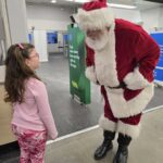 Santa talking to a little girl