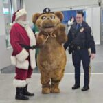 Santa, State trooper, and the state trooper mascot.