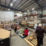 Volunteers grabbing some boxed foood