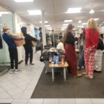 Volunteers carrying boxes